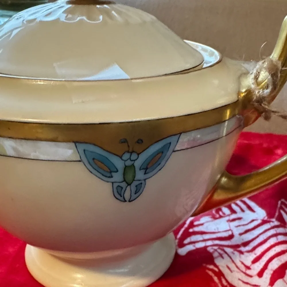 Elegant Gold and Cream Teapot with Blue Accents